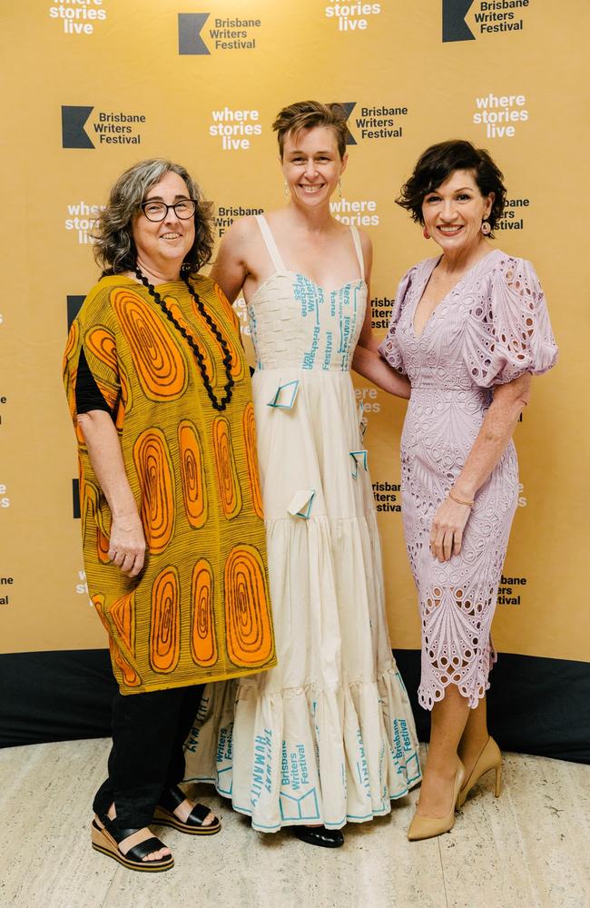 Brisbane Writers Festival chair Fiona Taylor, with CEO Sarah Runcie - in her dress made from last year’s tote bags - and Arts Minister Leeanne Enoch at the Marion Taylor Opening Night Gala at the Queensland Art Gallery.