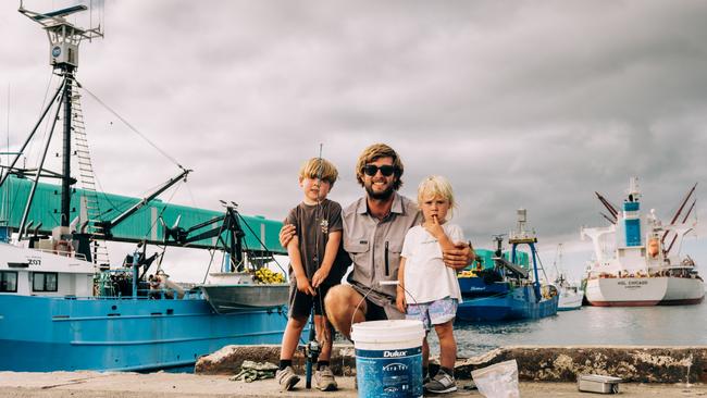 Jack Papadopoulos with Beau, 4, and Leon, 2, fishing at Port Lincoln Wharf. Picture: Robert Lang