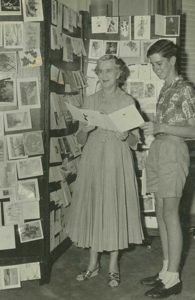 Lady Sybil Lavarack with her grandson, William, arranging Christmas cards in Brisbane in 1950. Picture: State Library of Queensland