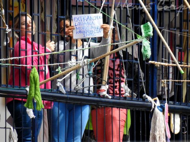 She waved her arms through the bars, asking to be let out of prison. Picture: Nathan Edwards