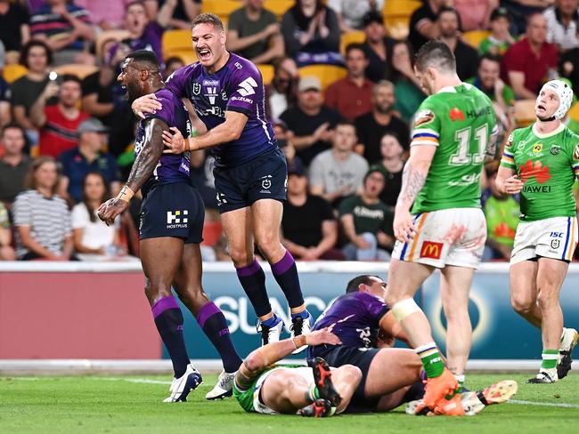 Suliasi Vunivalu and Brenko Lee of the Storm celebrate Dale Finucane of the Storm scoring a try during the NRL Preliminary Final match between the Melbourne Storm and the Canberra Raiders at Suncorp Stadium on October 16, 2020 in Brisbane, Australia. (Photo by Bradley Kanaris/Getty Images)