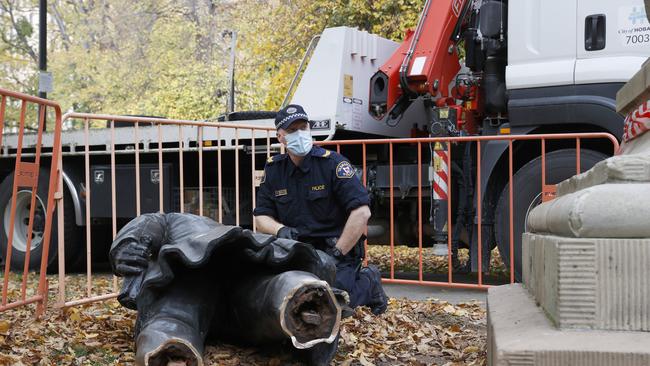 Tasmania Police in attendance gathering evidence. The William Crowther statue in Franklin Square Hobart has been vandalised overnight resulting in the statue being removed from it's plinth and then removed by Hobart City Council. Picture: Nikki Davis-Jones