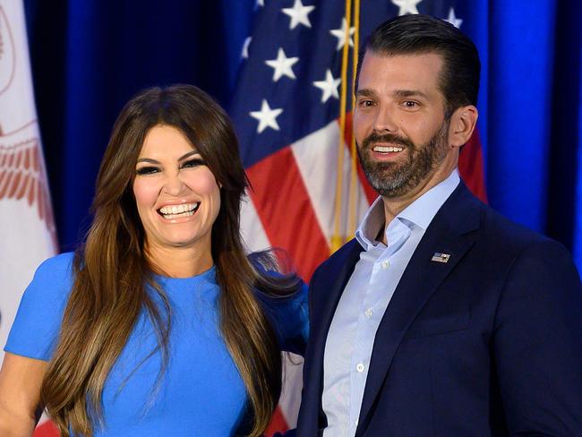 (FILES) In this file photo taken on February 3, 2020 Donald Trump Jr. (R) and his girlfriend Kimberly Guilfoyle smile during a "Keep Iowa Great" press conference in Des Moines, IA. - Donald Trump Jr's his girlfriend Kimberly Guilfoyle tested positive for the coronavirus on July 3, 2020, US media reported. (Photo by JIM WATSON / AFP)