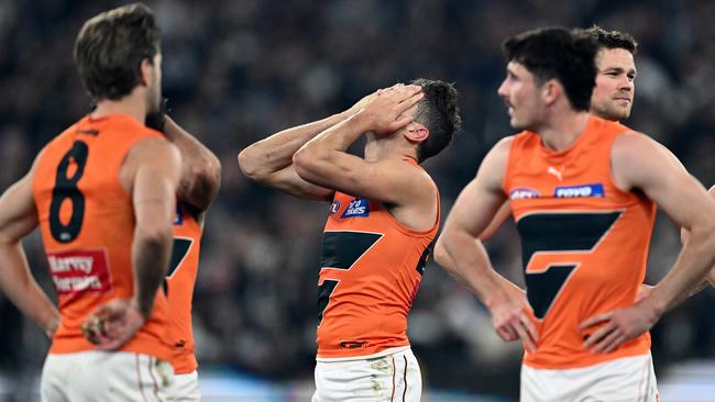 MELBOURNE, AUSTRALIA – SEPTEMBER 22: The Giants look dejected after losing the AFL First Preliminary Final match between Collingwood Magpies and Greater Western Sydney Giants at Melbourne Cricket Ground, on September 22, 2023, in Melbourne, Australia. (Photo by Quinn Rooney/Getty Images)