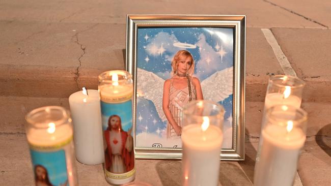 Candles are placed around a photo at a vigil for Hutchins in 2021. Picture: AFP