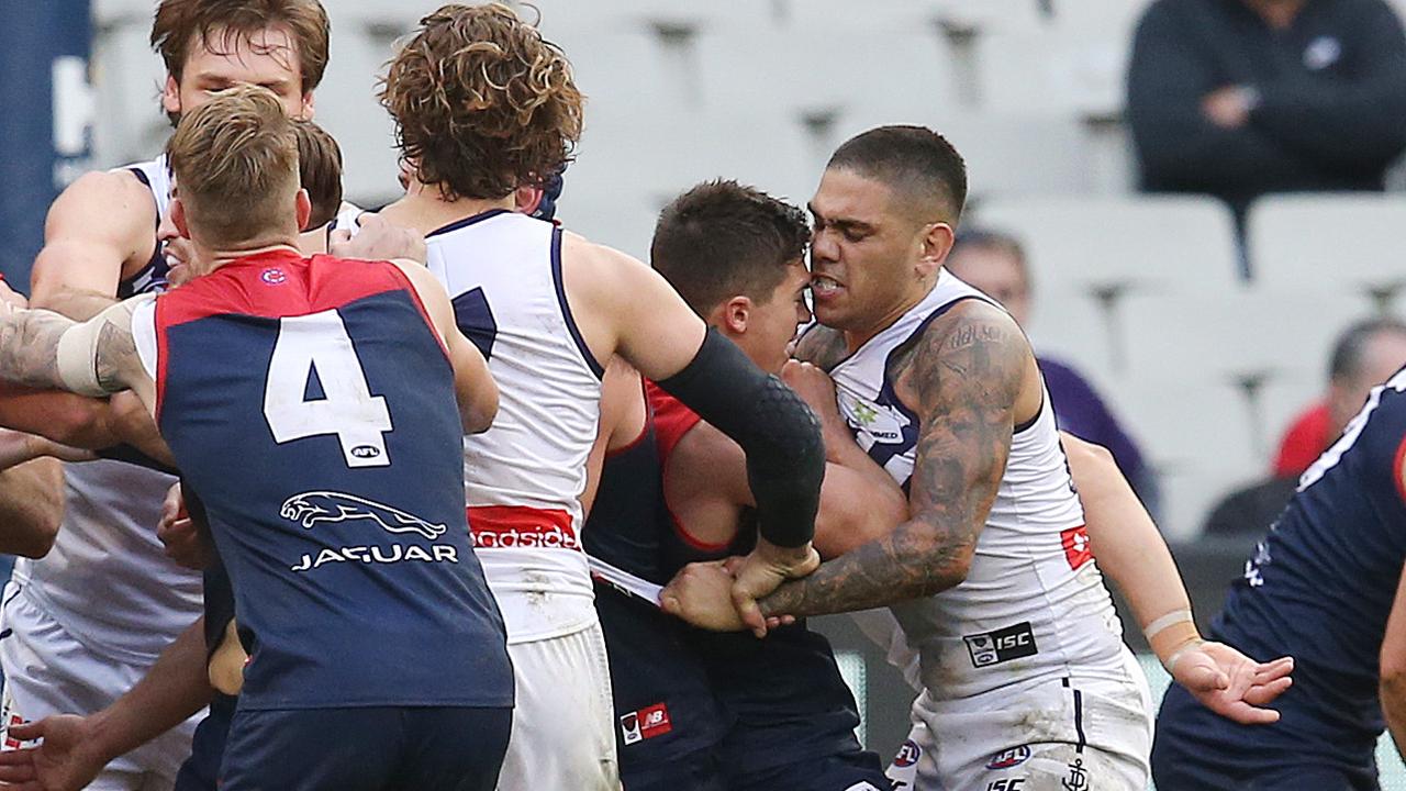 Michael Walters gets reported for head butting Melbourne's Jay Lockhart . Pic: Michael Klein
