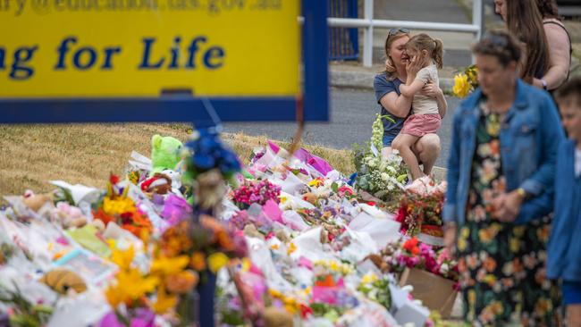 Mourners pay tribute to the children who died after gust of wind swept away a jumping castle at Hillcrest Primary School Devonport Tasmania. Picture: Jason Edwards