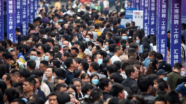 People attend a job fair in China's southwestern city of Chongqing in April. Picture: AFP