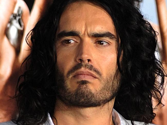 (FILES) Actor Russell Brand poses on the red carpet as he arrives for the premiere of the comedy movie "Get Him to the Greek" from Universal Pictures at the Greek Theatre in Los Angeles on May 25, 2010. British comedian and actor Russell Brand has been accused of rape, sexual assaults and emotional abuse during a seven-year period, according to the results of a media investigation published on September 16, 2023. (Photo by MARK RALSTON / AFP)