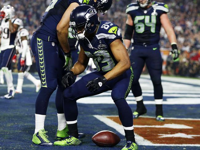 GLENDALE, AZ - FEBRUARY 01: Doug Baldwin #89 of the Seattle Seahawks celebrates after catching a three yard touchdown pass against the New England Patriots in the third quarter during Super Bowl XLIX at University of Phoenix Stadium on February 1, 2015 in Glendale, Arizona. Christian Petersen/Getty Images/AFP == FOR NEWSPAPERS, INTERNET, TELCOS & TELEVISION USE ONLY ==