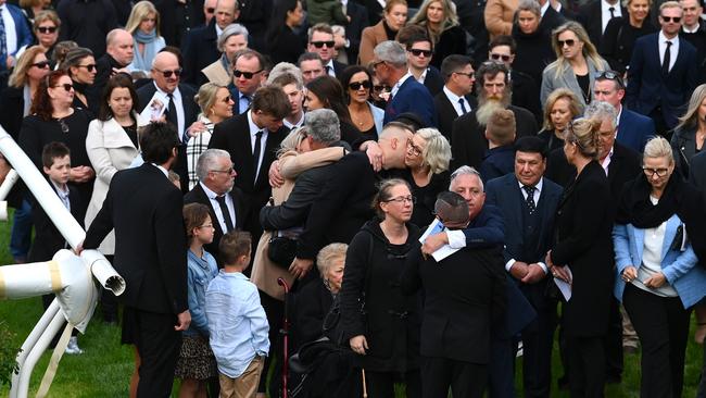 Mourners say their farewells.