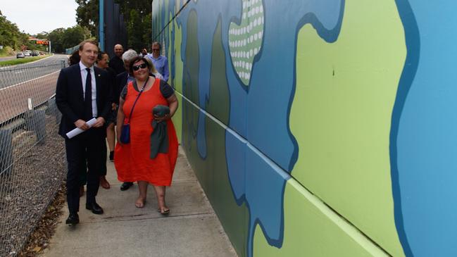 State MP for Manly James Griffin joins Cromer artist Jessica Birk, as well as local Aboriginal leaders and RMS officials, at an event marking the official completion of an Aboriginal mural — Shorelines and Storylines — alongside the Burnt Bridge Creek Deviation at North Balgowlah. Picture: RMS