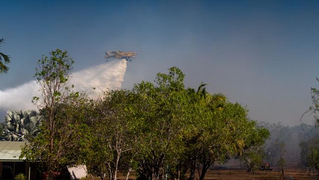 An aerial firefighting unit battles a bushfire at Humpty Doo on Tuesday. Picture: Che Chorley