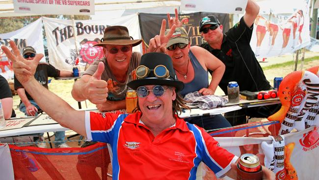 Steve Murray, Bargs, Tony Flett and Steve Kirkman keep  hydrated in the shade at Bathurst. Picture: Dylan Robinson