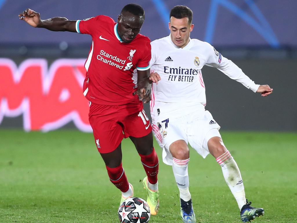 Sadio Mane and Lucas Vazquez compete for the ball.