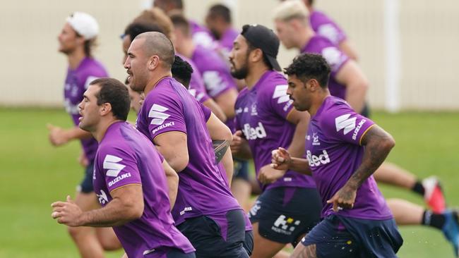 Dale Finucane (front) and Storm players run in a beep test exercise.