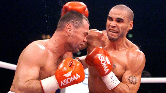 Anthony Mundine lands a punch on Sven Ottke during their 2001 fight.