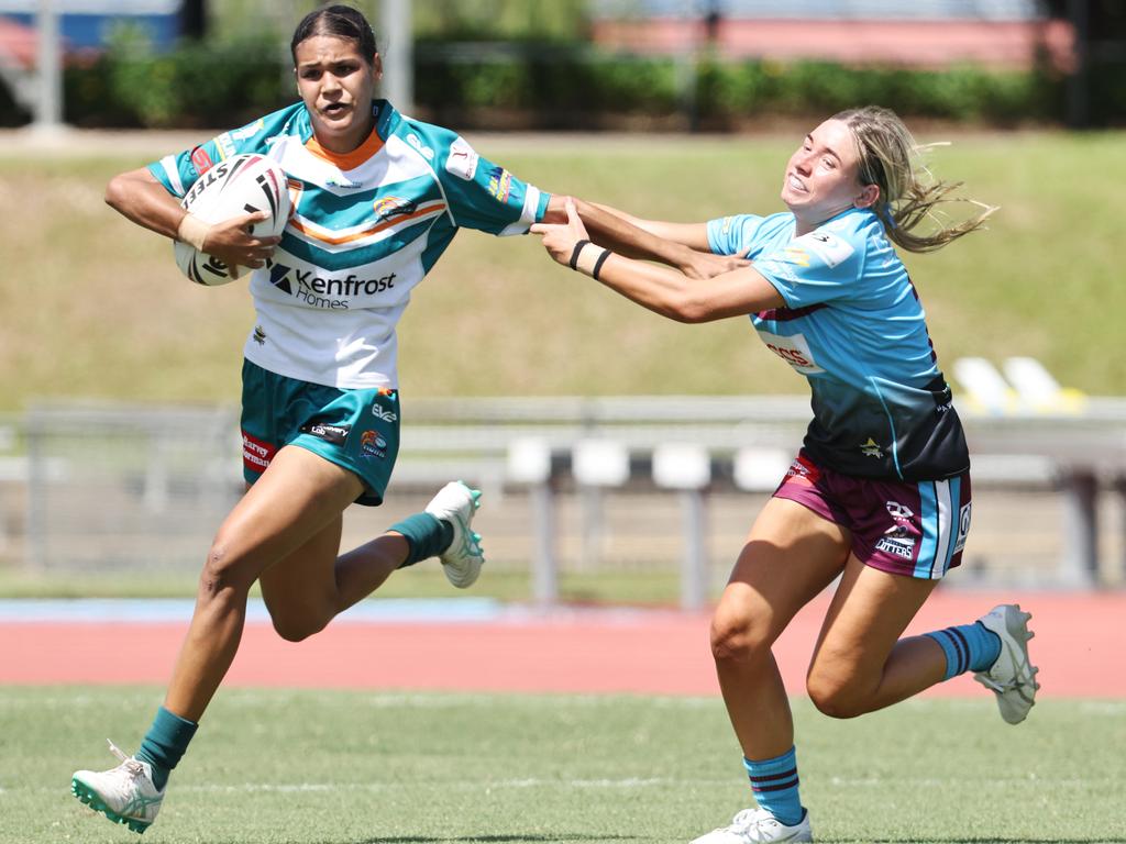 Jordana Woods fends off Cutters' Jaccoa Keyssecker in the Queensland Rugby League (QRL) Under 19 Women's match between the Northern Pride and the Mackay Cutters, held at Barlow Park. Picture: Brendan Radke