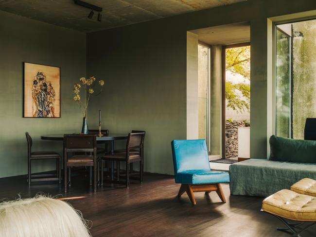 EMBARGO FOR WISH 05 APRIL 2024. FEE MAY APPLY. A sisal stool by Fernando Laposse (foreground) and a blue Pierre Jeanneret lounge chair in the family room of Boris VervoordtÃ¢â¬â¢s loft near Antwerp, Belgium. The painting is by Ida Barbarigo. Photography by Salva LÃÂ³pez for WSJ. Magazine