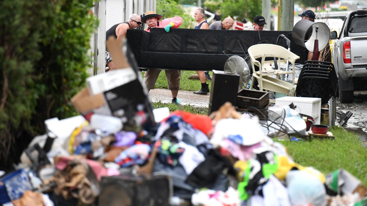 Flood-damaged items from homes in the suburb of Rosslea in Townsville, in 2019. Picture: AAP Image/Dan Peled.