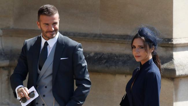 David Beckham was all smiles, while his wife ... was not. Credit: AFP Photo/Pool and AFP Photo/Odd Andersen