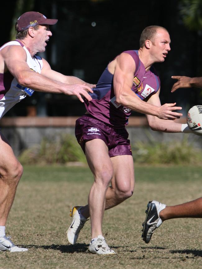 Brad Thorn (left) attempts to tackle Darren Lockyer at a Broncos training session. Picture: David Kapernick