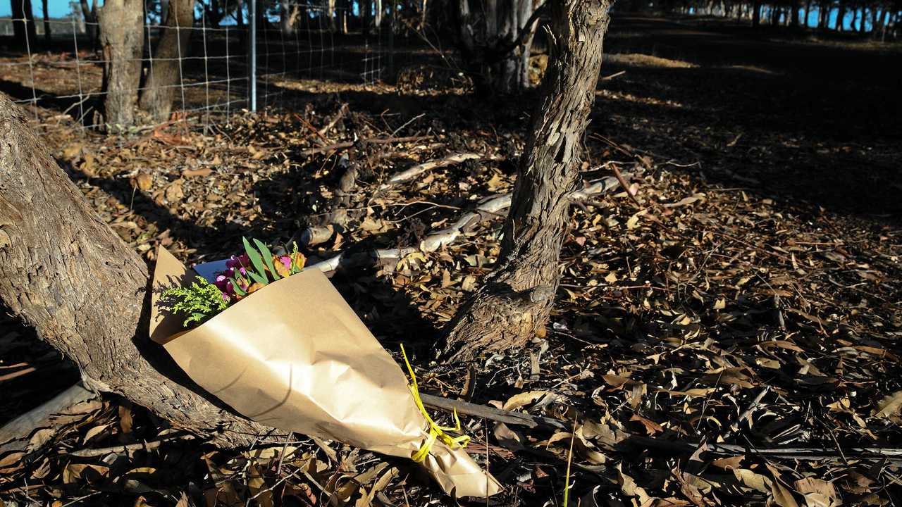 Flowers left next to a police roadblock where police are investigating the death of seven people in suspected murder-suicide in Osmington, east of Margaret River. Picture: RICHARD WAINWRIGHT