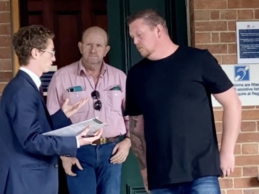 Aaron Sutherland (far right, in black shirt) outside Grafton Local Court.