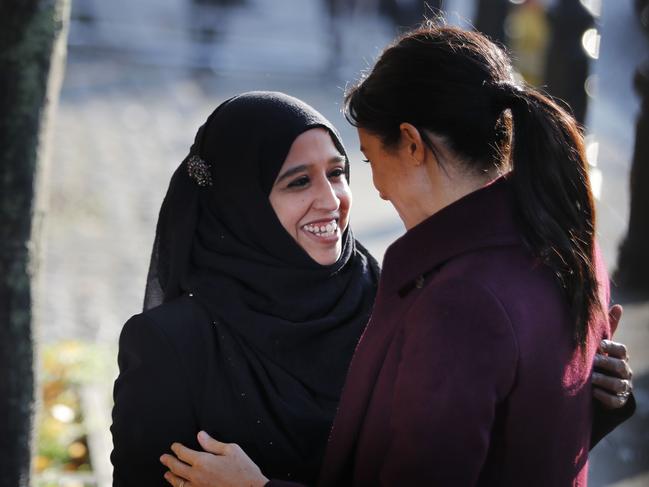 Meghan is greeted by Zaheera Sufyaan, Hubb Community Kitchen co-co-ordinator. Picture: AFP