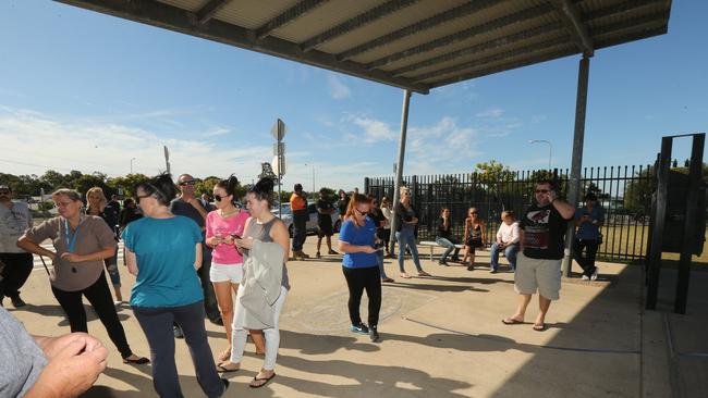 Police, parents and students at the Upper Coomera State College after the school went into lockdown over social media threats. Picture Mike Batterham