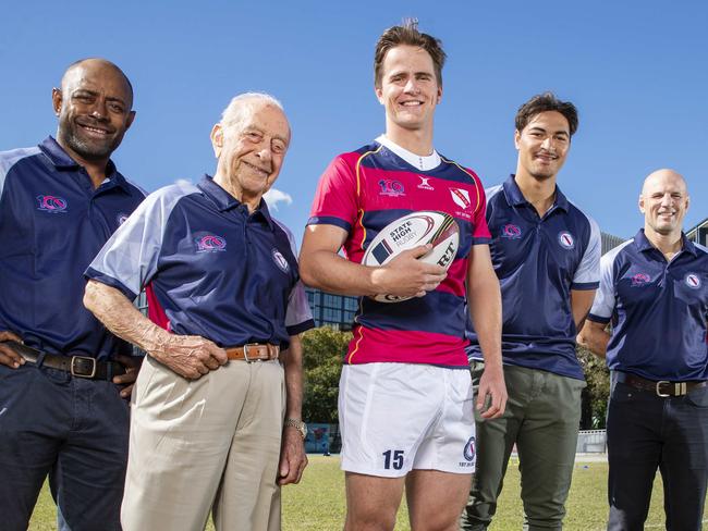 Former Wallaby Mosese Raulini, Dr Nick Girdis First XV captain and school captain in 1943, 2021 team captain and current school captain, Luke Hatherall, current Wallaby Jordan Petaia and former Wallaby Mark Bartholemeusz on the pitch at Brisbane State High. Picture Lachie Millard