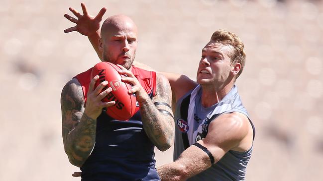 Nathan Jones marks in front of Jack Watts. Picture: Getty Images