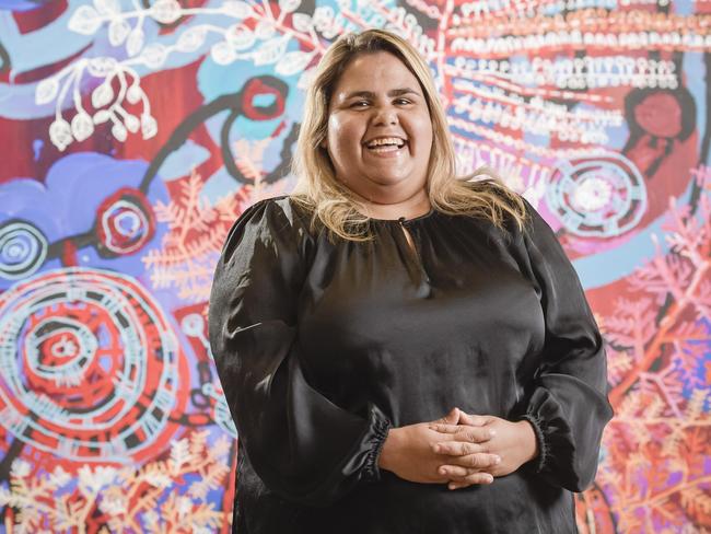 Sally Scales pictured with her artwork about her homeland ÃAralyaÃ in the APY studio Adelaide.Sally Scales is an artist and young leader emerging on the national stage. She feels strongly about the rights of Aboriginal artists to make a fair living from their work and has devoted a lot of her time and skills to protecting elders from carpet baggers in the desert art world. Ms Scales, 31, is also calling for clear succession planning in the world of Aboriginal leaders, where she sees a form of ageism that ignores some important young talent.Friday 5 March 2021 Pic Roy VanDerVegt.