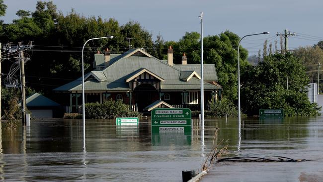 A building underwater next to the Hawkesbury River at the submerged Windsor Bridge. Prime Minister Scott Morrison announced disaster payments for Richmond Valley LGA. Picture: NCA NewsWire / Damian Shaw