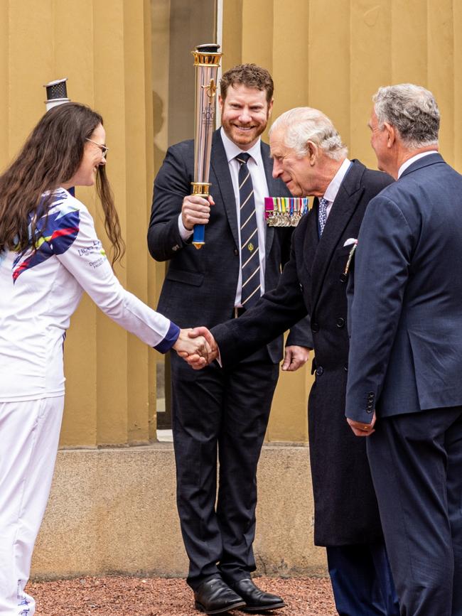 King Charles at Buckingham Palace with Dan Keighran and the Legacy torch. Picture: Callum Smith