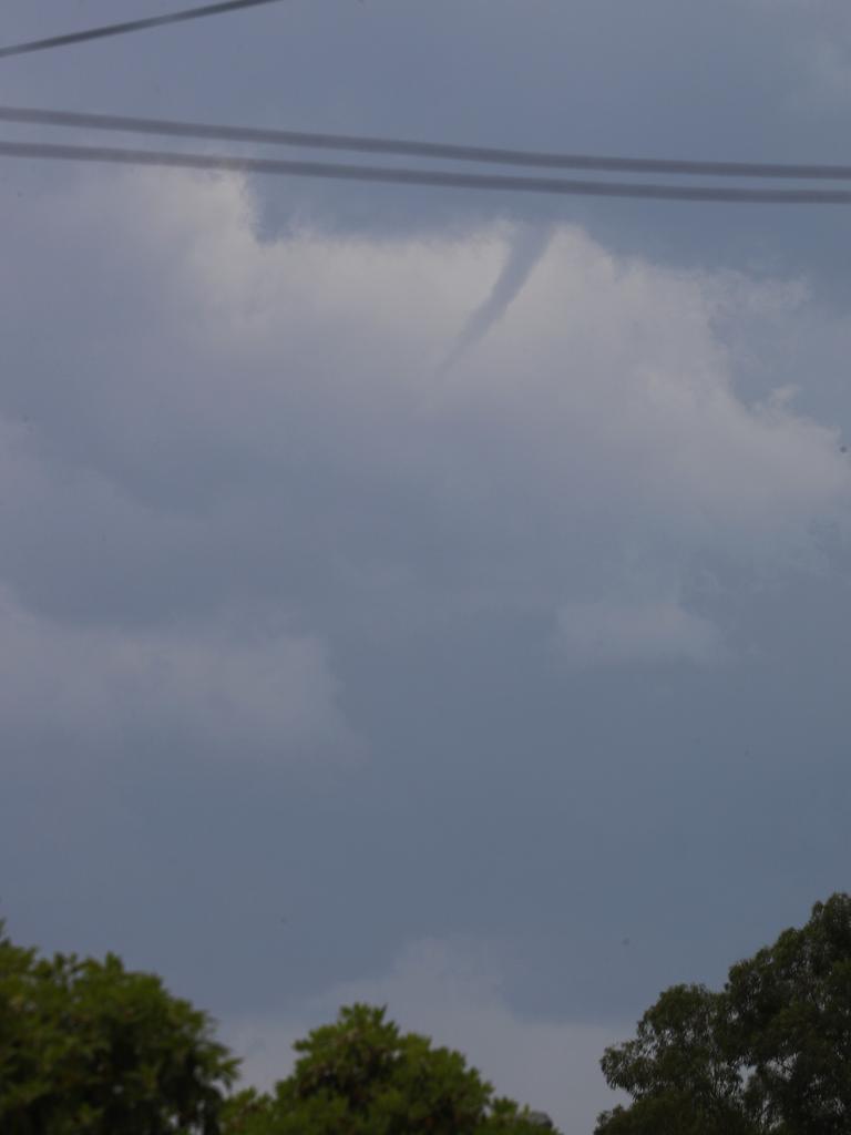 Severe storms line up Sydney this afternoon a funnel cloud appears south of Chester hill and rain and wind hit streets of Chester hill. Picture: John Grainger