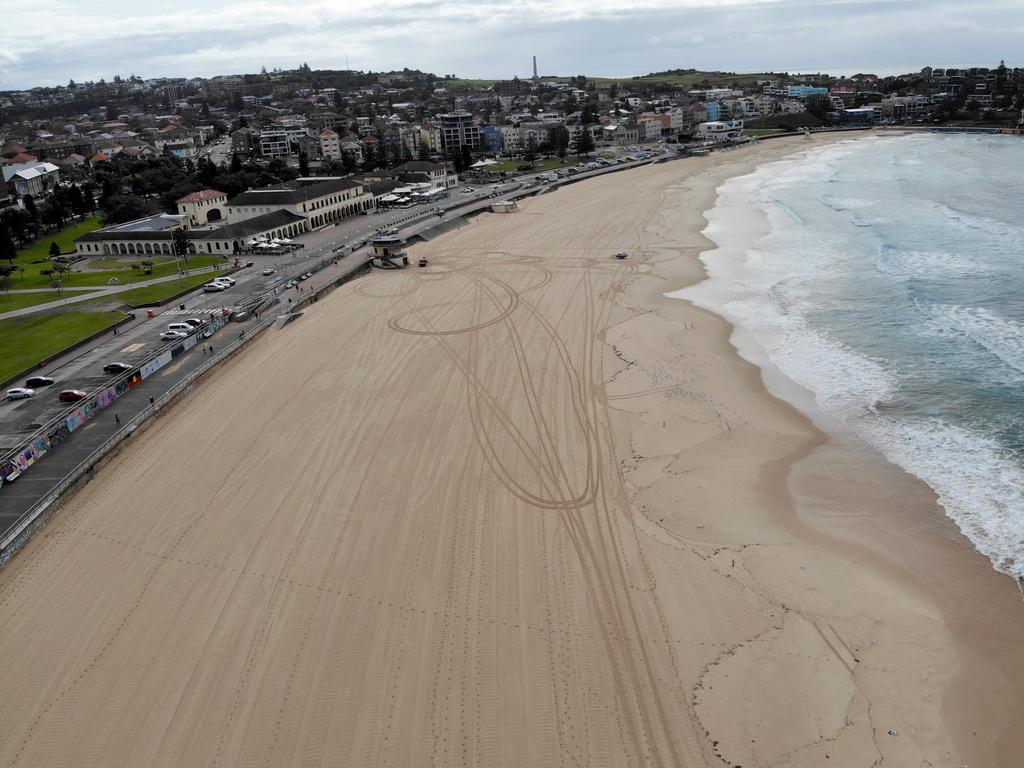 The effect of coronavirus takes affect on various places around Sydney with crowds being told not to congregate in public places. A deserted Bondi Beach after being shut down by the government to prevent social spreading of the virus. Picture: Toby Zerna