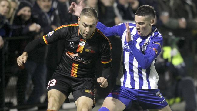 MetroStars’ Christian Esposito (left) against West Adelaide.