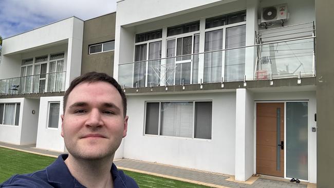 Mr Dilleen in front of a townhouse complex in WA that he scored for a discount.