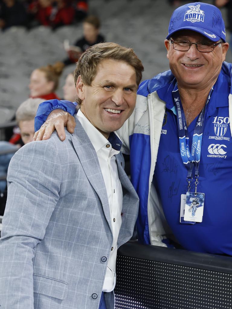Channel 7 commentator Kane Cornes chats with North Melbourne fan John. Picture: Michael Klein