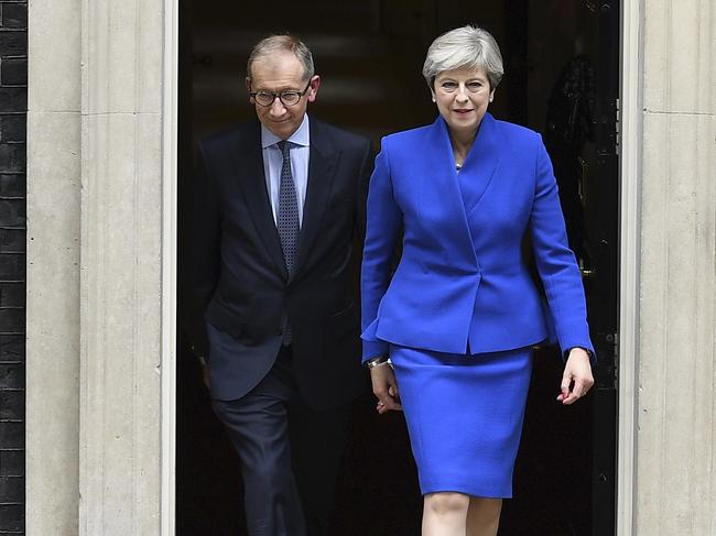 LONDON, ENGLAND - JUNE 09:  Prime Minister Theresa May leaves Downing Street with her husband Philip to go to Buckingham Palace where she will seek the Queen's permission to form a UK government on June 9, 2017 in London, England. After a snap election was called by Prime Minister Theresa May the United Kingdom went to the polls yesterday. The closely fought election has failed to return a clear overall majority winner and a hung parliament has been declared.  (Photo by Leon Neal/Getty Images)