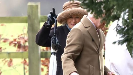 Queen Camilla waves as she joined King Charles at a church service in Sandringham on Sunday. Picture: AFP