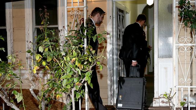 Police at the Brunswick home. Picture: Mark Stewart