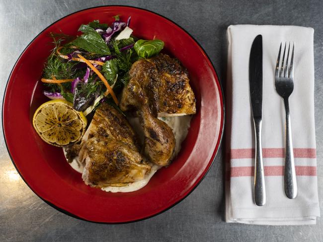 The harissa-roasted chicken with tahini, yoghurt, red cabbage and herb slaw. Picture: Matthew Vasilescu