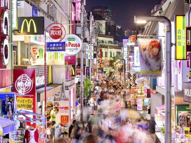 ESCAPE: DOC HOLIDAY 26 JUNE  ..   Tokyo, Japan - August 6, 2015: Crowds walk through Takeshita Street in the Harajuku district at night. Harajuku is a center of Japanese youth culture and fashion. . Picture: iStock