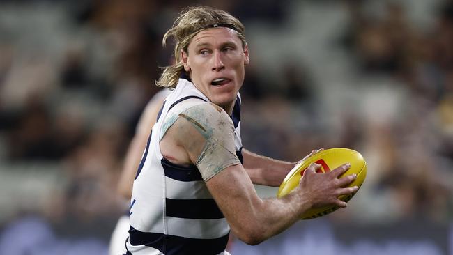 MELBOURNE, AUSTRALIA - JULY 16: Mark Blicavs of the Cats runs with the ball during the round 18 AFL match between the Carlton Blues and the Geelong Cats at Melbourne Cricket Ground on July 16, 2022 in Melbourne, Australia. (Photo by Darrian Traynor/Getty Images)