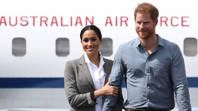 Prince Harry and his wife Meghan, the Duchess of Sussex disembark from their plane following their arrival in Dubbo last year.