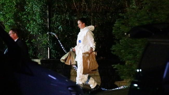 Forensic officers at the family home. Picture: Bill Hearne