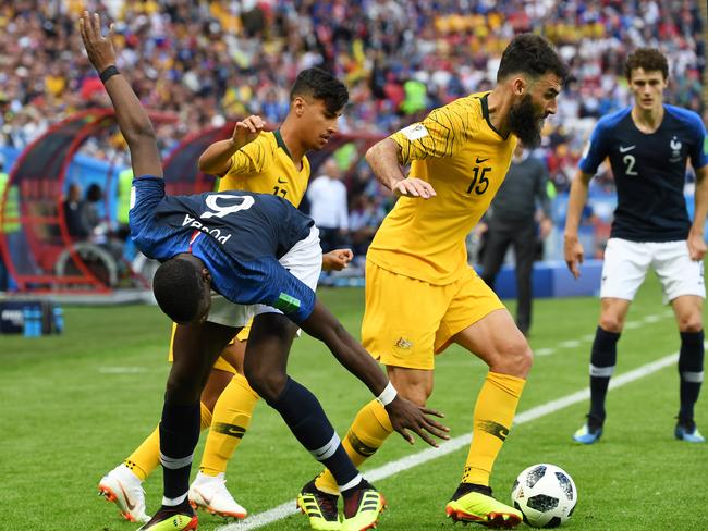 Mile Jedinak (R, #15) takes the ball off French star Paul Pogba. Pic: AAP