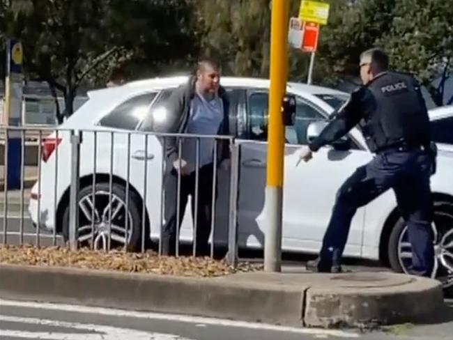 Police arresting Matthew Brian Ramsay, who allegedly stabbed a woman in the chest on her doorstep in Dover Heights. Picture: 7 News